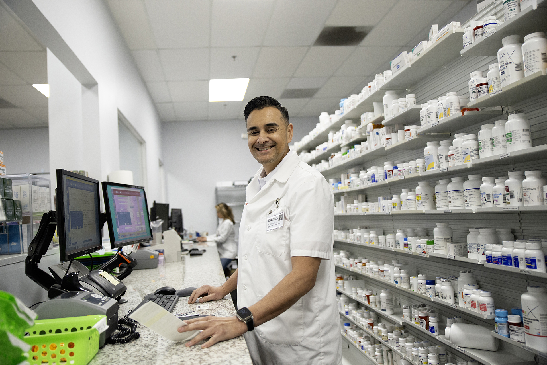 A photo shows Touro University California College of Pharmacy graduate Dr. Richie Dueñas inside his independent pharmacy in Vallejo, Jan. 15, 2025.